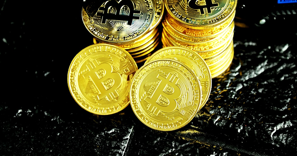 gold round coins on black table