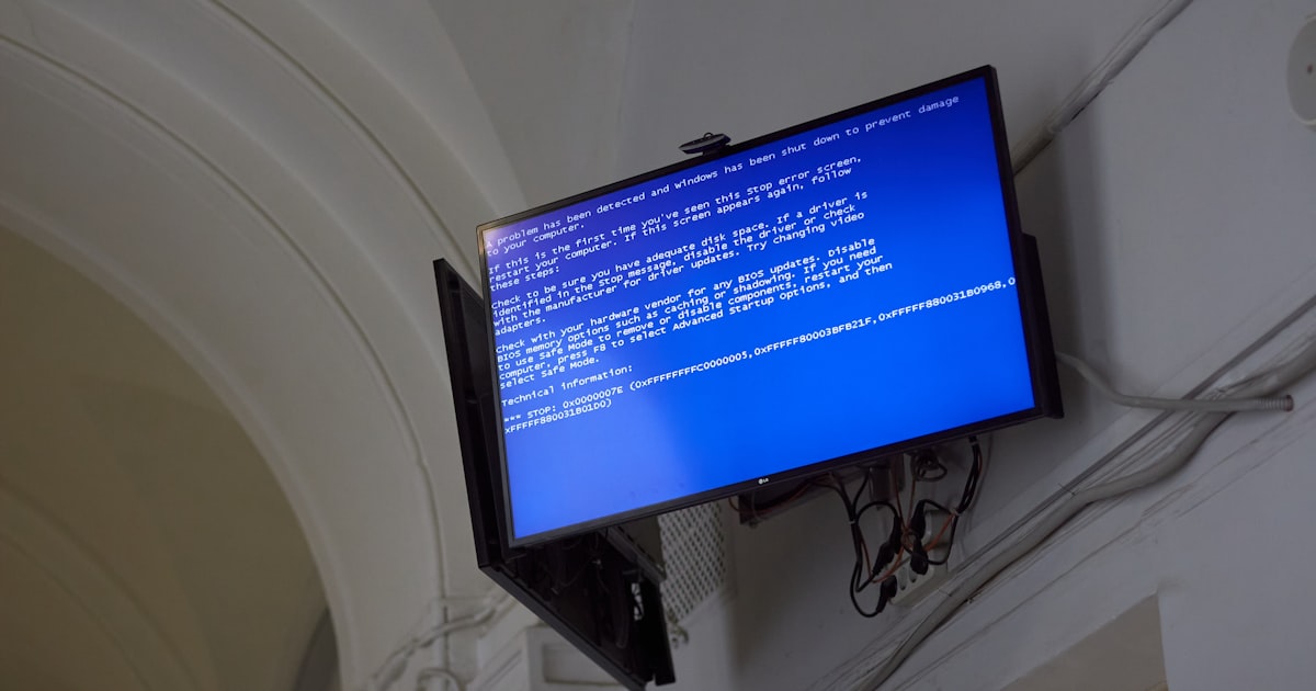The TV displays a blue screen of death.