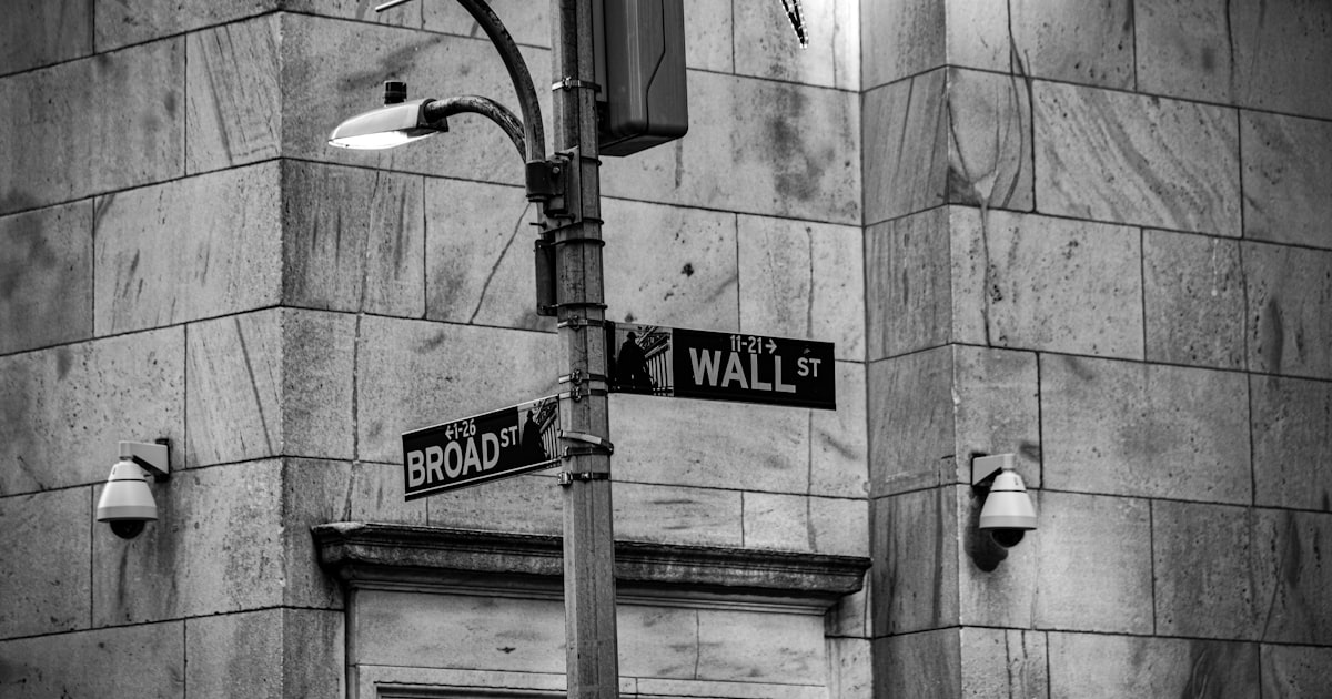a black and white photo of a street sign