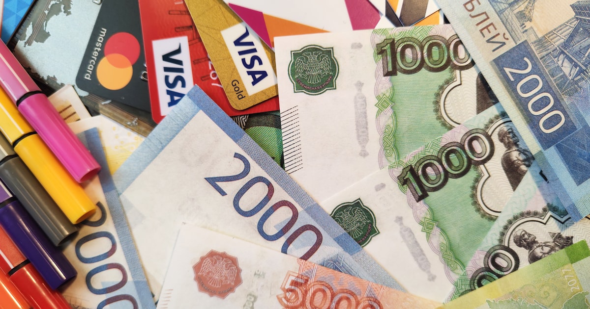 a pile of money with markers on it