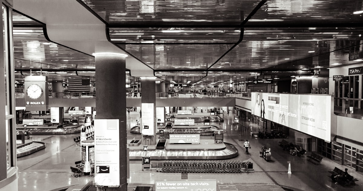 a black and white photo of a train station
