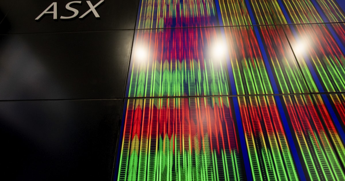 a tall building with a sign that says asx on it