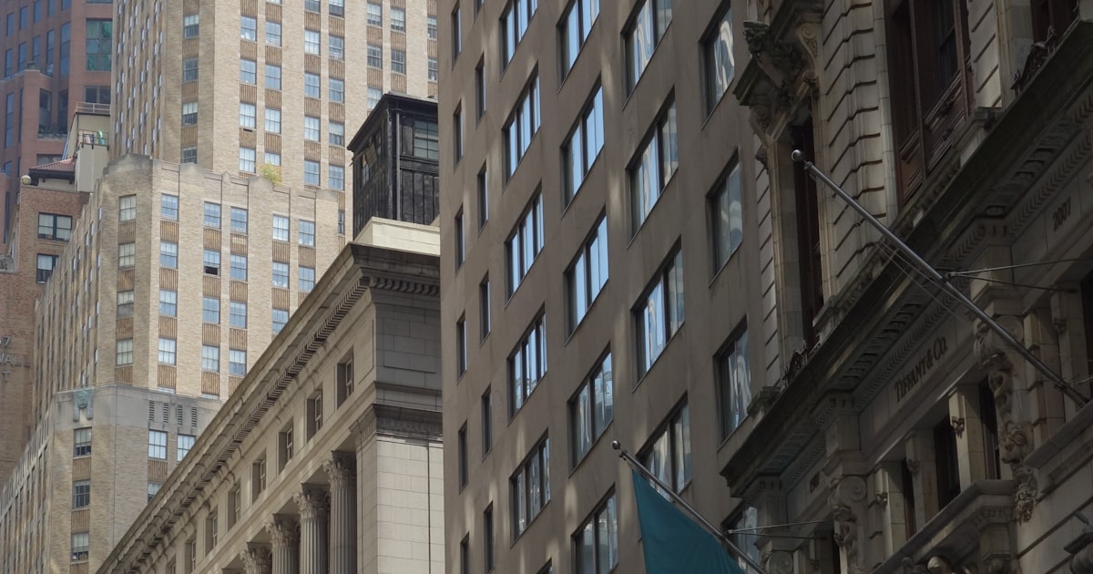 a tall building with a clock on the top of it