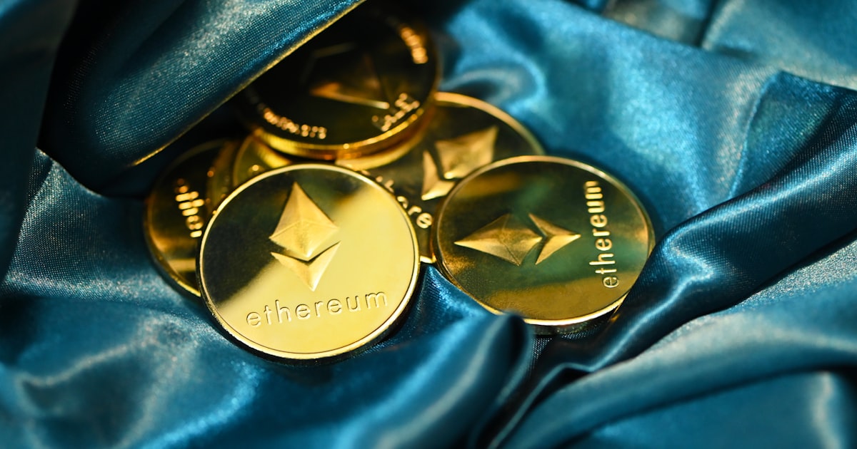 a close up of some gold buttons on a blue cloth