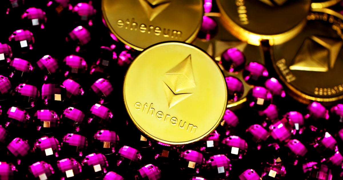 a pile of shiny gold and purple tokens