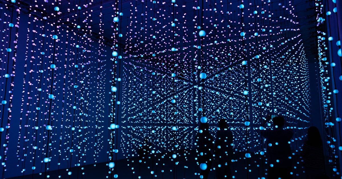blue and green lights on black background