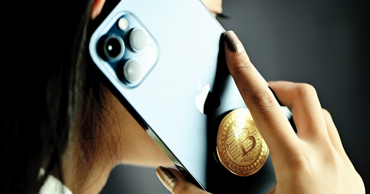 person holding white and black smartphone case