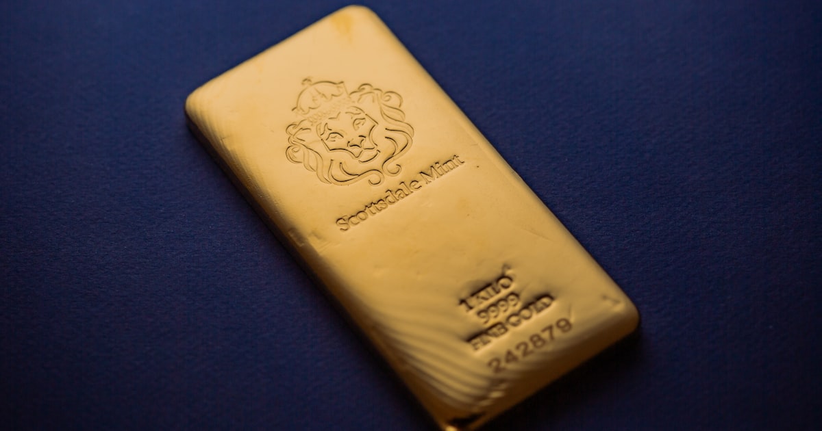 A gold bar sitting on top of a blue table