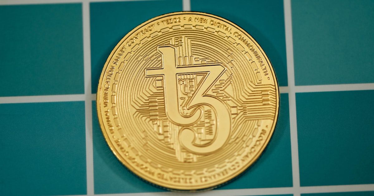a close up of a coin on a tiled surface