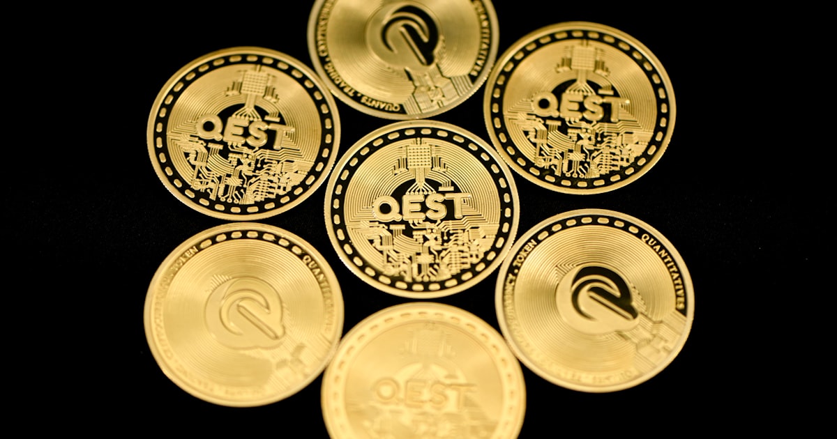 a group of five gold coins sitting on top of each other