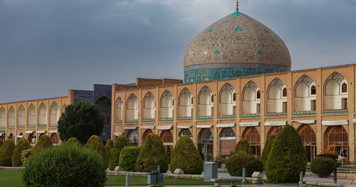 a large building with a green dome on top of it