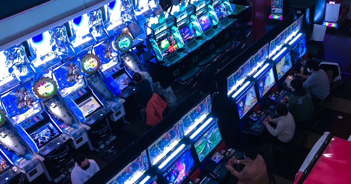 a group of people playing video games inside of a building
