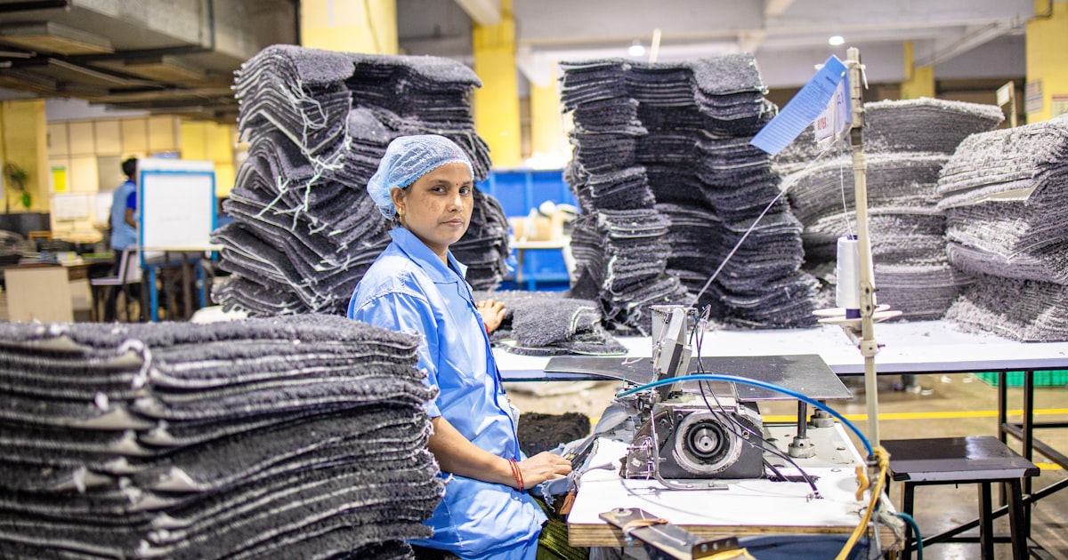 A woman works in a factory.