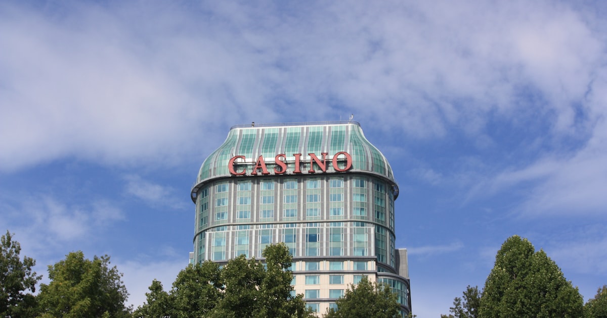 A casino building stands tall under a blue sky.