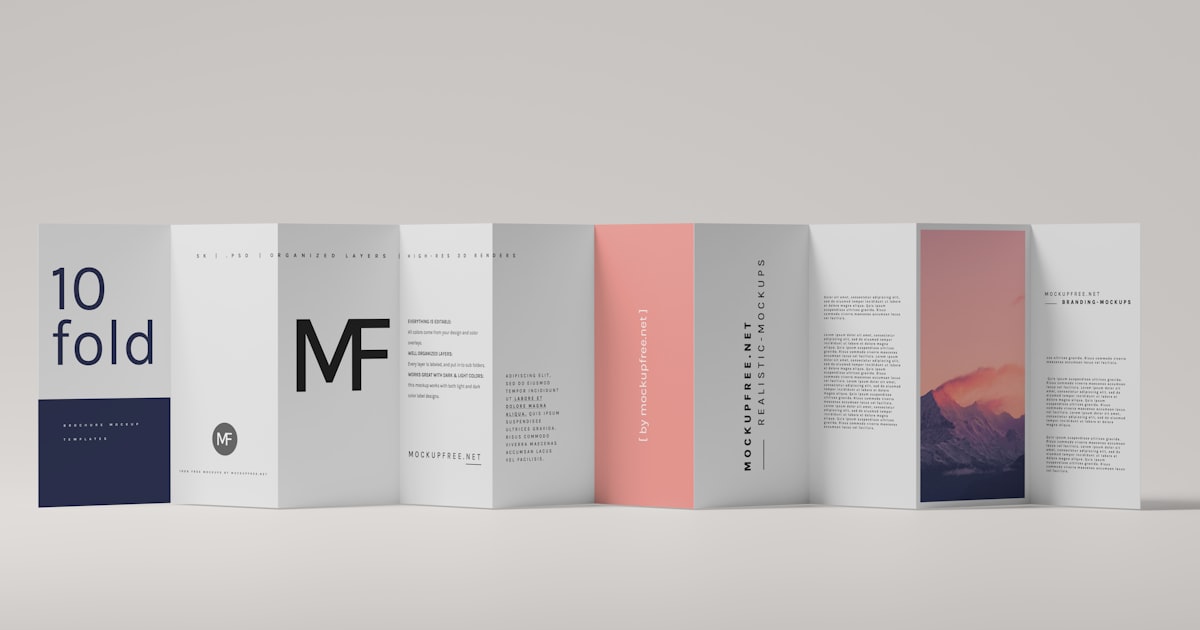a row of folded brochures with a mountain in the background