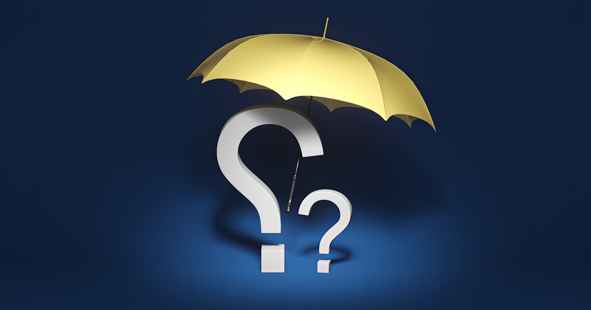 a yellow umbrella with a question mark underneath it