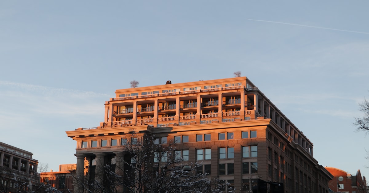a tall building with lots of windows on top of it
