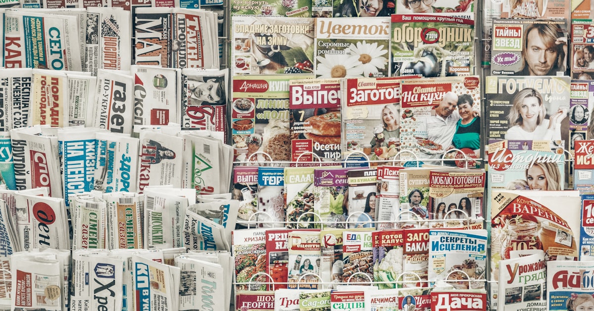 assorted-title magazines displayed on stand