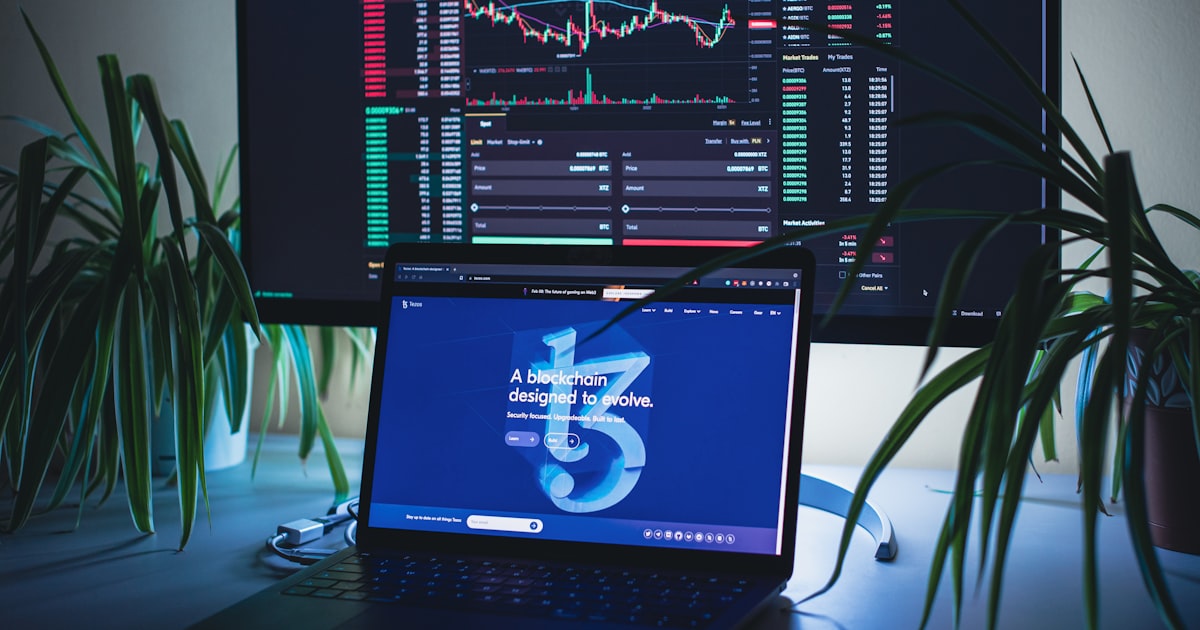 a laptop computer sitting on top of a desk