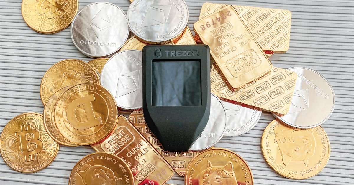 a cell phone sitting on top of a pile of coins