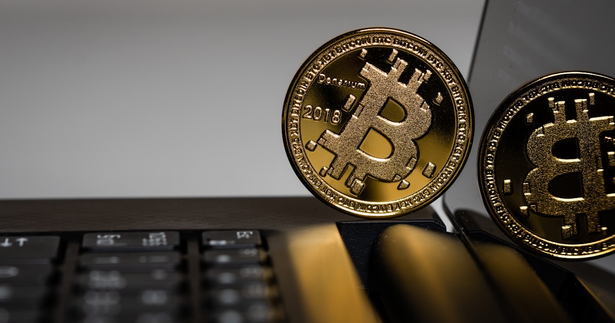 two gold Bitcoins