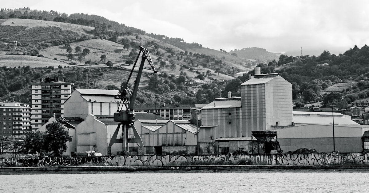 Industrial buildings with crane by the water