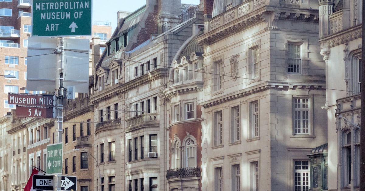 a city street filled with lots of tall buildings