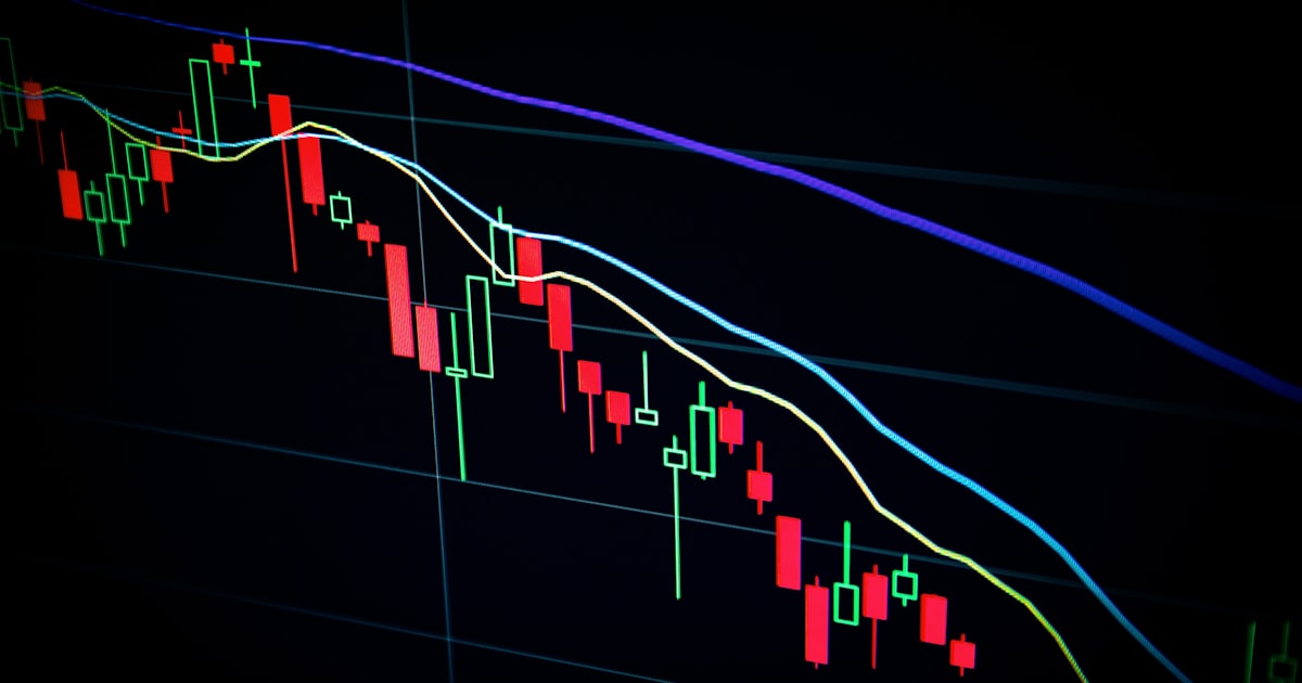 stock market candlestick chart on dark screen