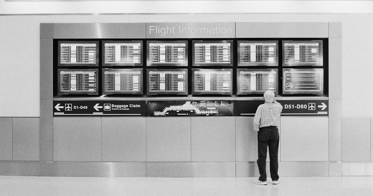 man looking at the flight information