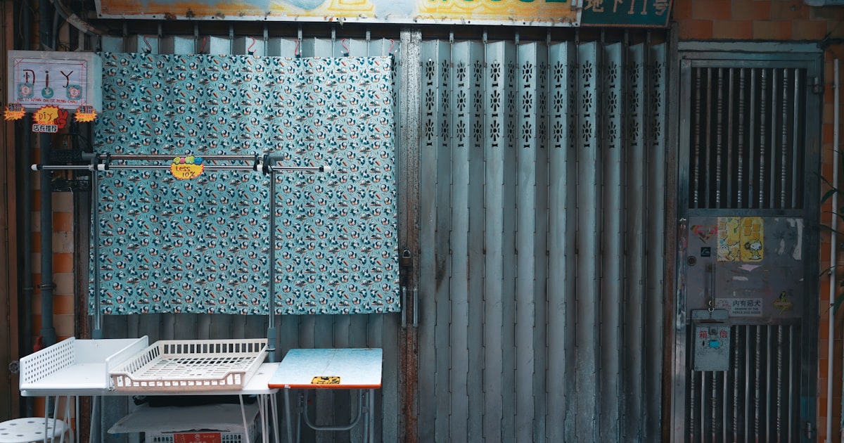 a building with a door and a table outside