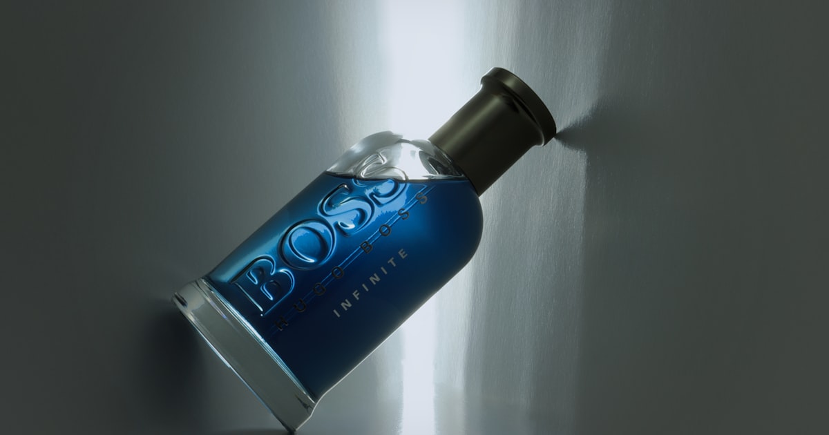 a bottle of booze sitting on a wall