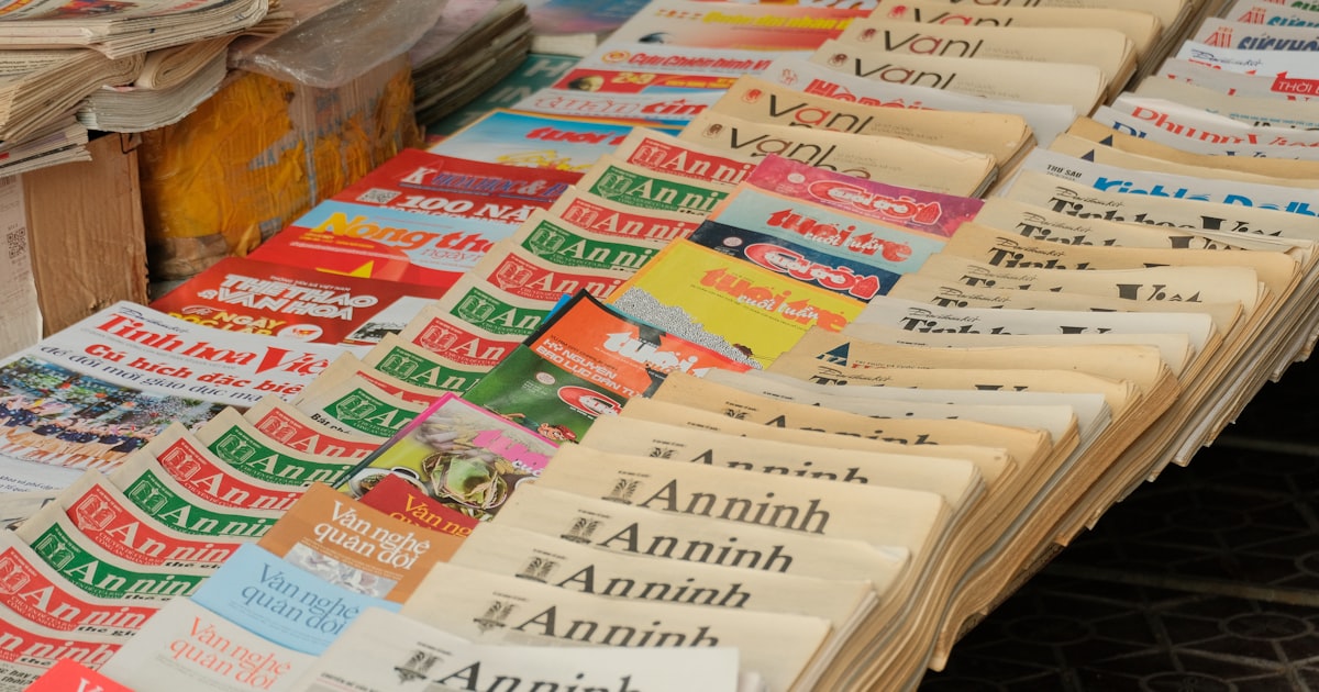 Newspapers and magazines displayed on a table