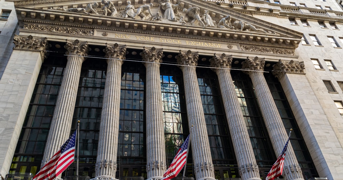 a building with columns and flags