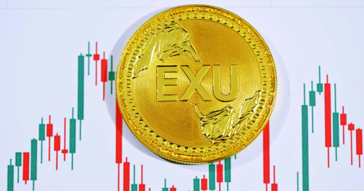 gold round coin with letter m