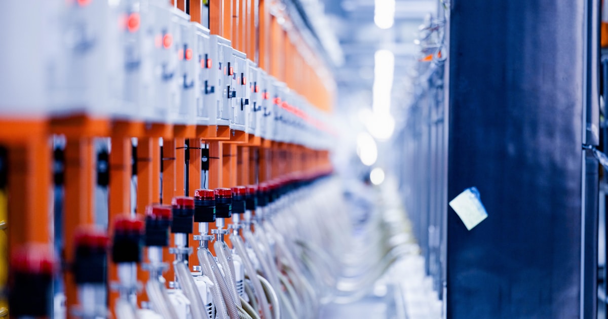 a row of orange and white electrical wires