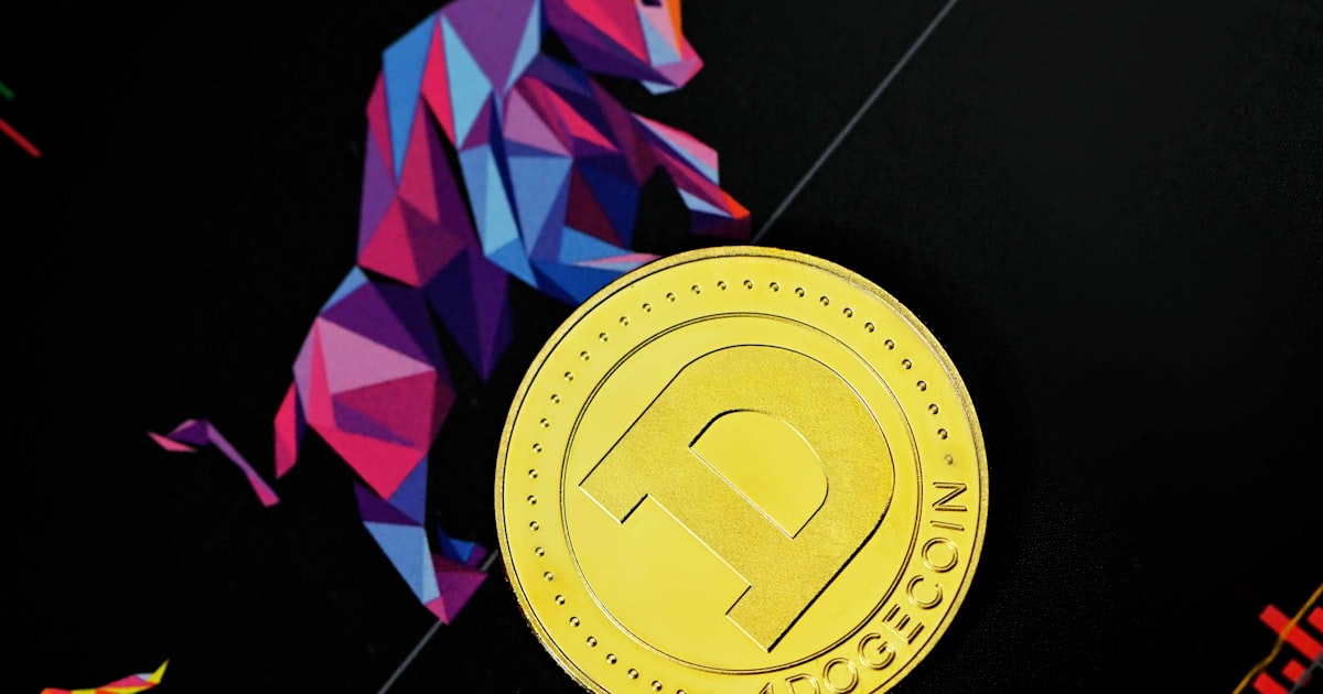 a close up of a gold coin on a black surface