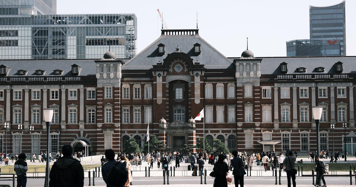 a group of people standing in front of a building