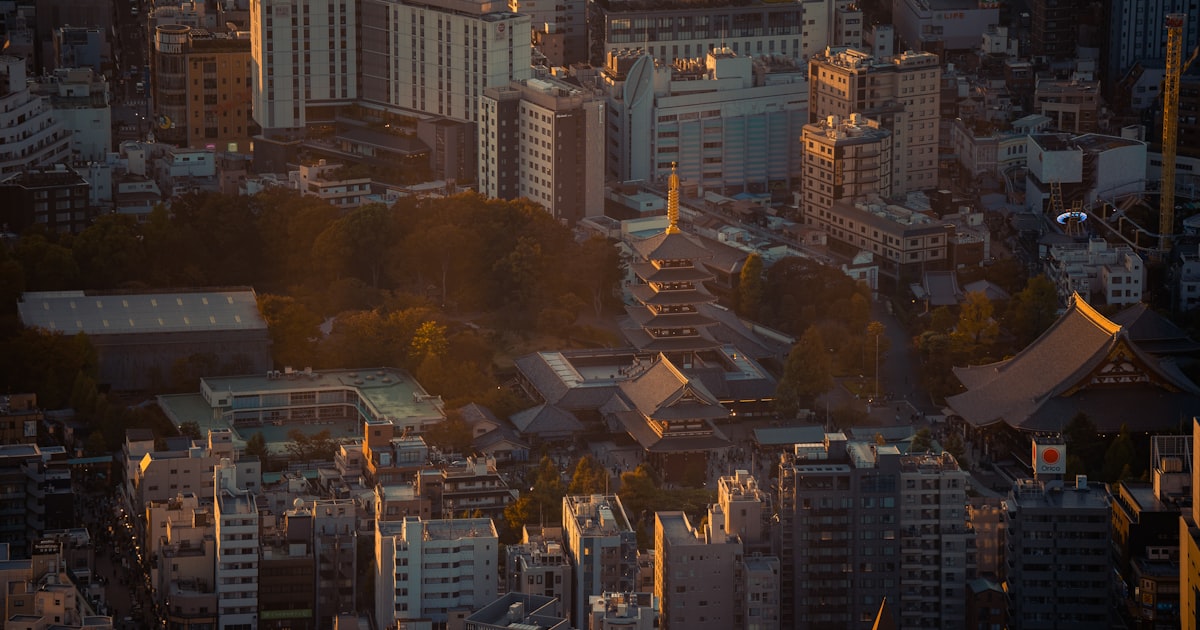 an aerial view of a city with tall buildings
