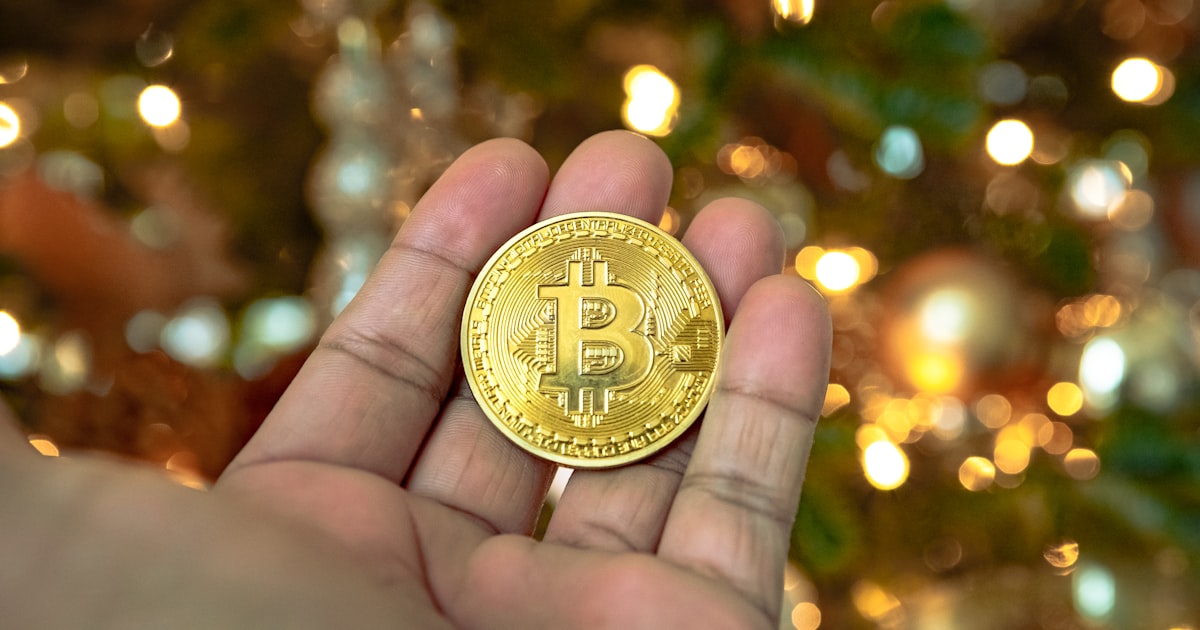 gold round coin on hand