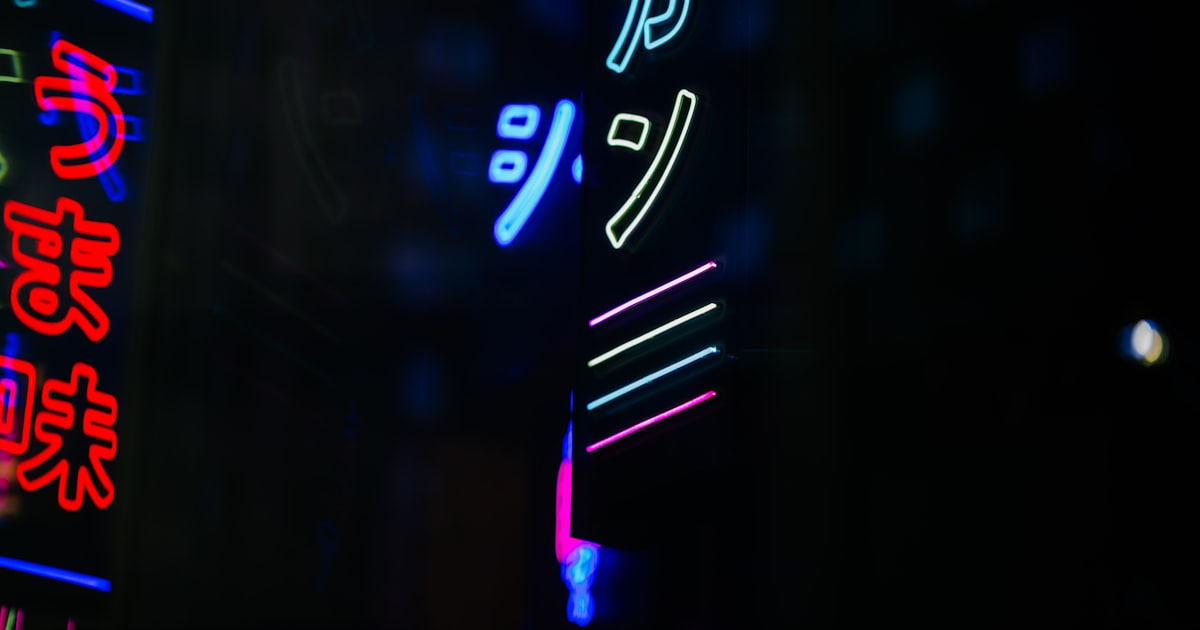 Glowing neon signs in japanese at night