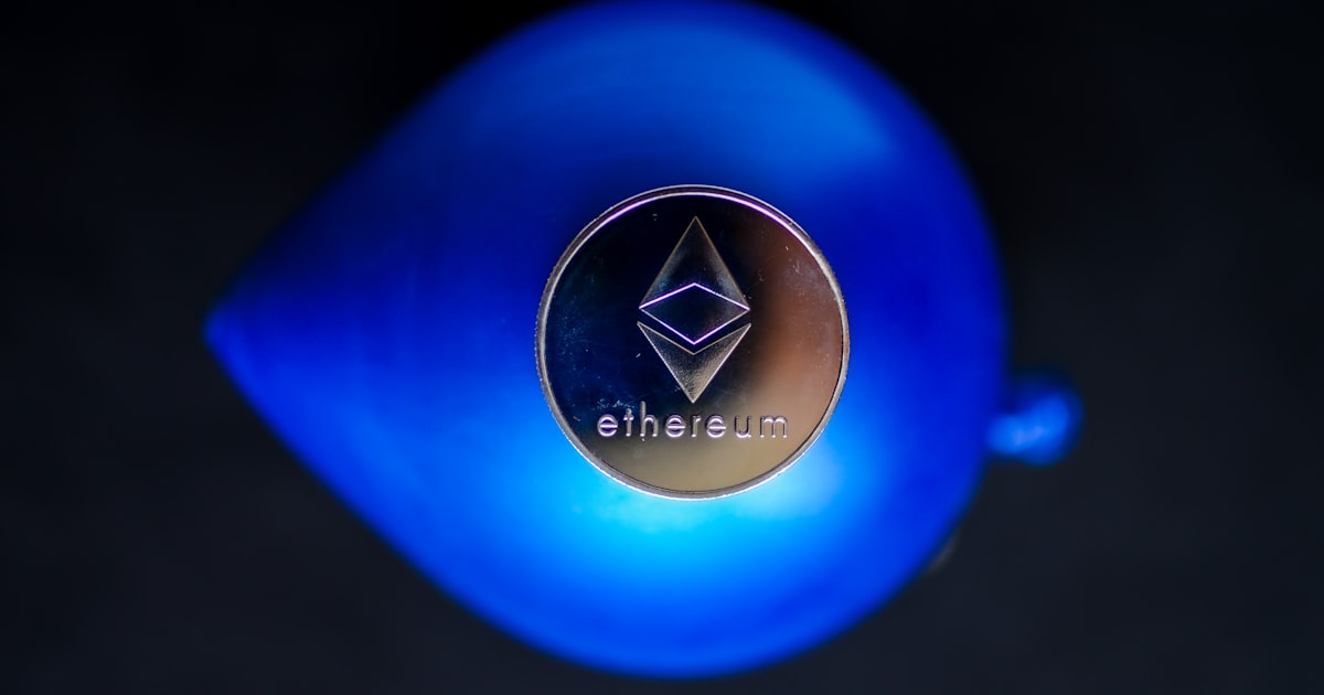a close up of a blue vase with a logo on it