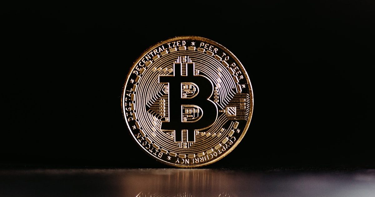 a bit coin sitting on top of a table