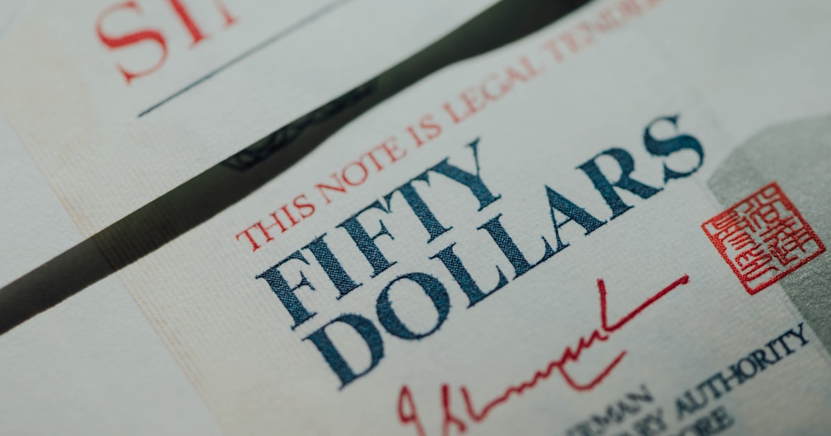 white printer paper with red and black text