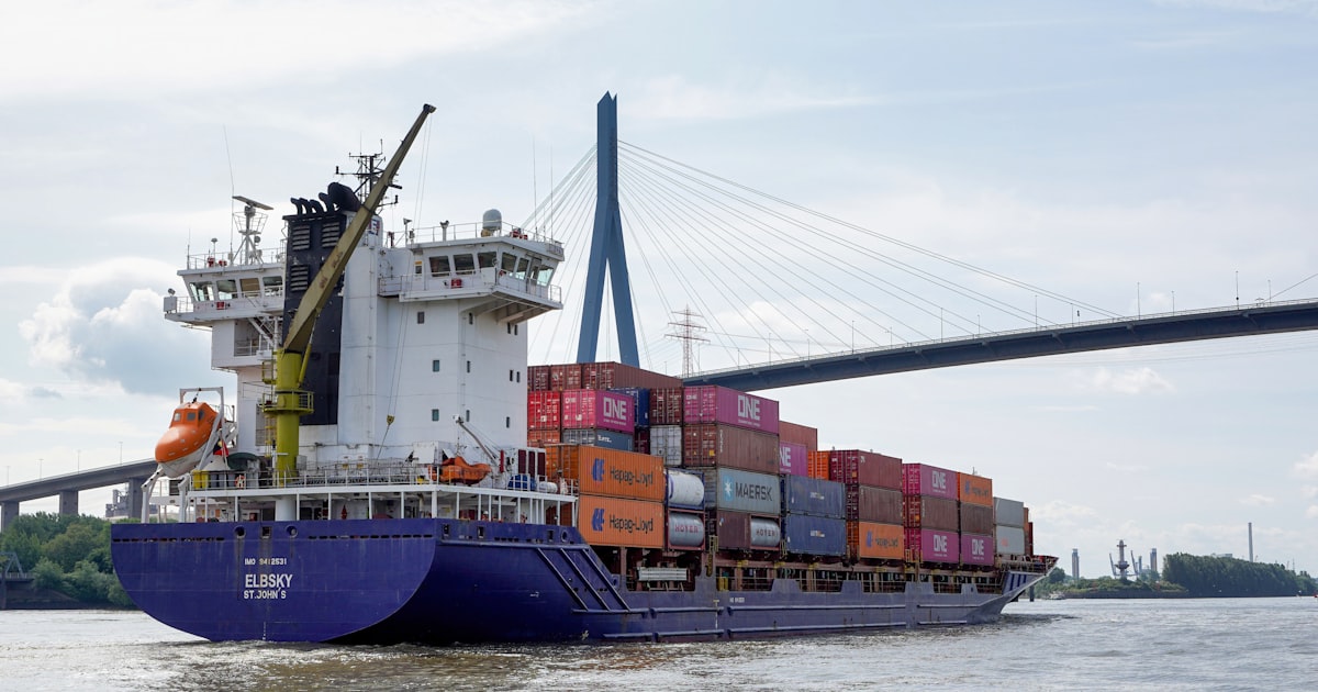 A large cargo ship carrying containers on the water.