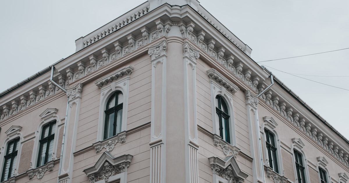 beige concrete building under blue sky during daytime