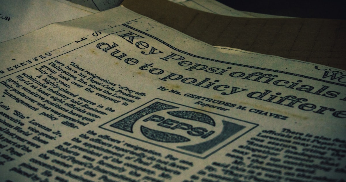 a pile of newspapers sitting on top of a table