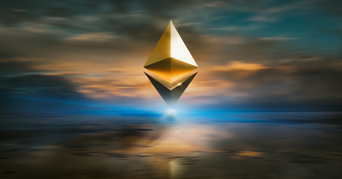 yellow and black triangular structure under cloudy sky during sunset