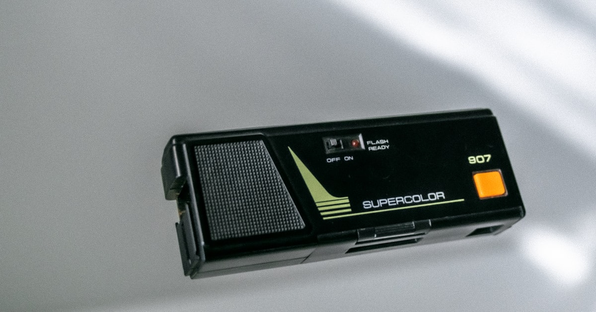 a black radio sitting on top of a white table