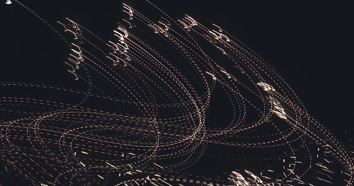 a black and white photo of a bunch of lights