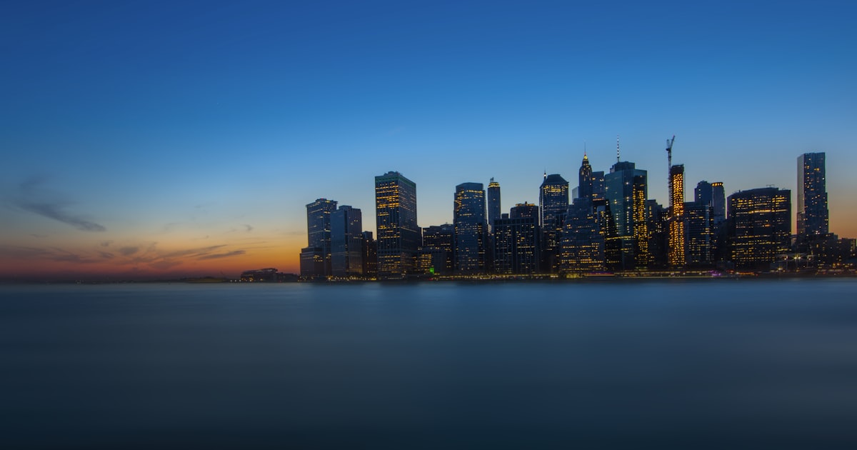 a view of a city at night from across the water